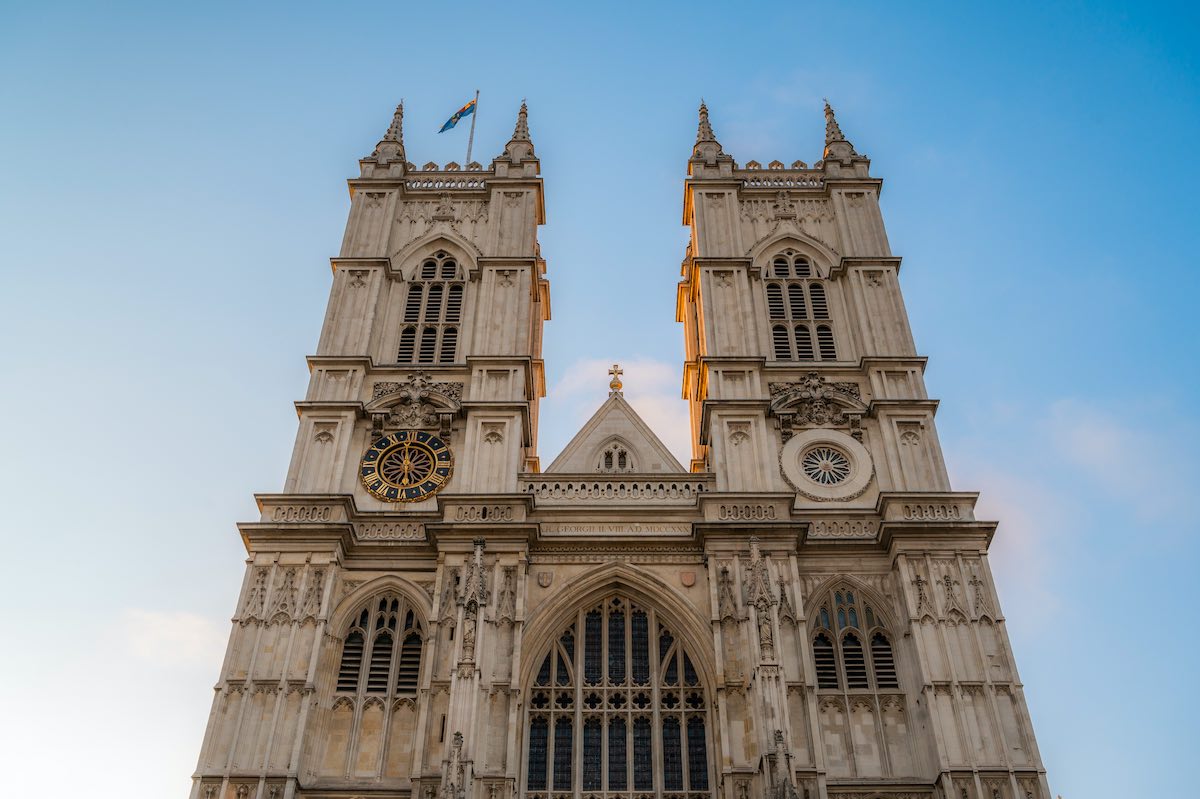 Main facade of Westminster Abbey against blue sky , Gothic style, in London, England, United Kingdom